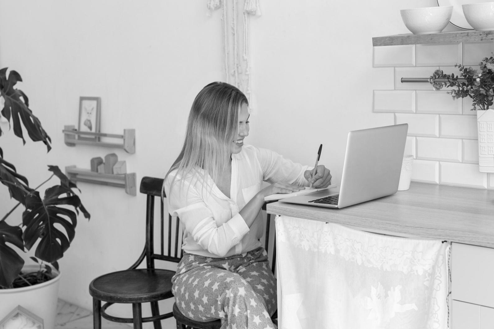 Financial analyst reviewing complex market data charts and graphs on multiple screens